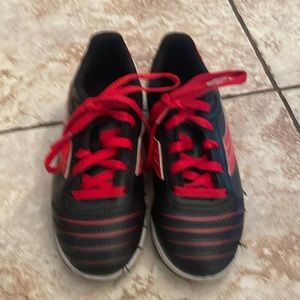 Black and red indoor soccer cleats for boys
